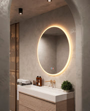 Espejo de baño con luz LED en marco iluminado redondo · Modelo ATENAS