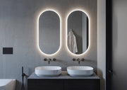 Espejo de baño con luz LED ovalado a medida retroiluminado y luz frontal · Modelo DENOR [config]
